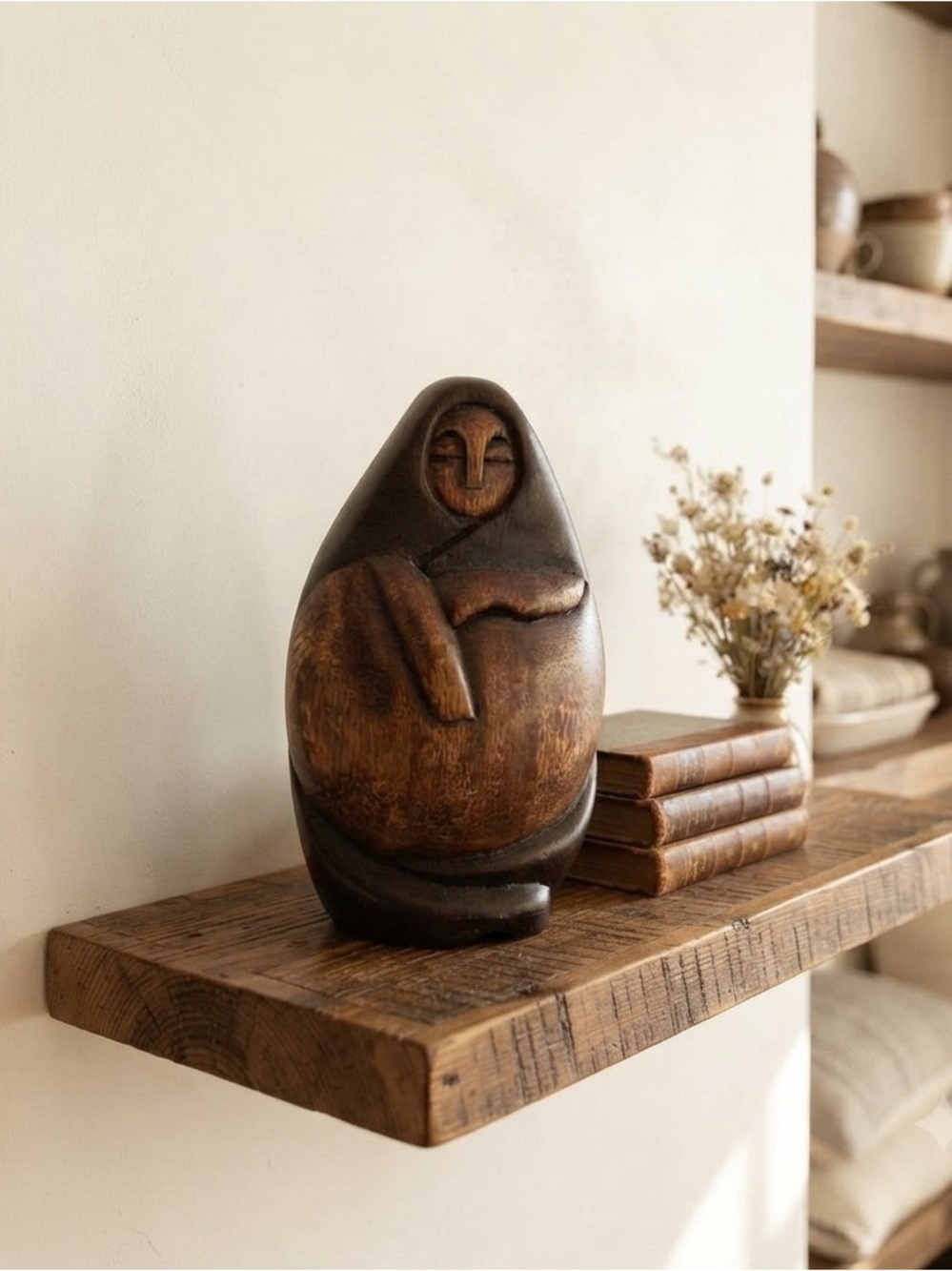 vintage Peruvian wood sculpture, often depicting a nurturing mother